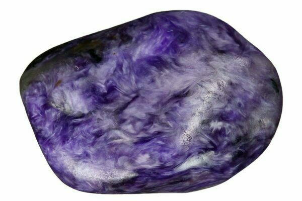 A polished charoite stone showing its distinctive, swirling patterns.